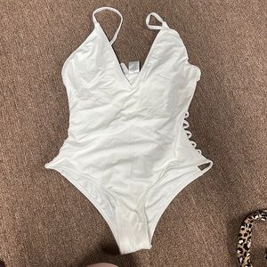 NWT Dippin Daisys Swimwear-white one piece with open sides. Medium